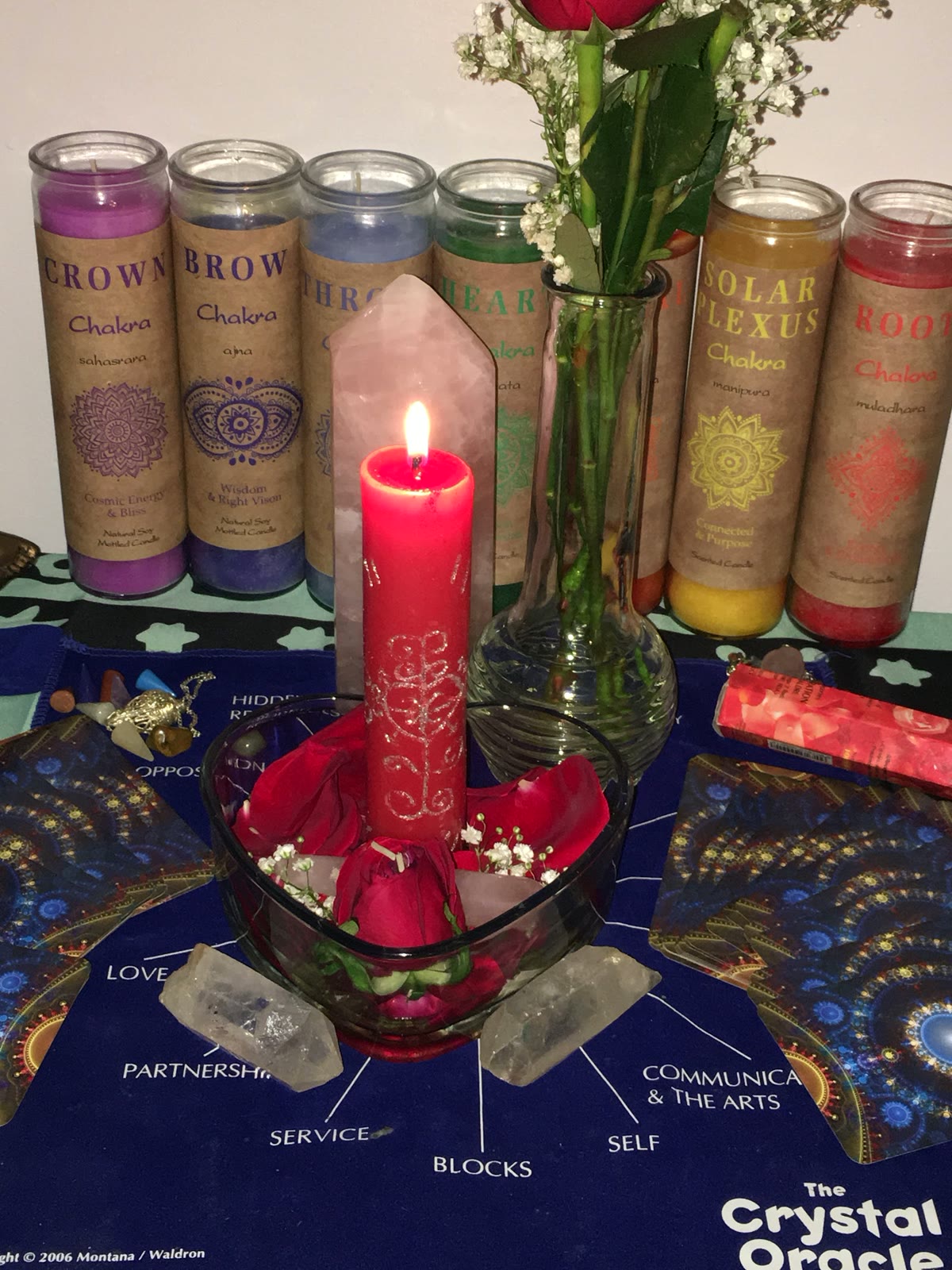Chakra candles, rose quartz and oracle cards at Lansing Psychic