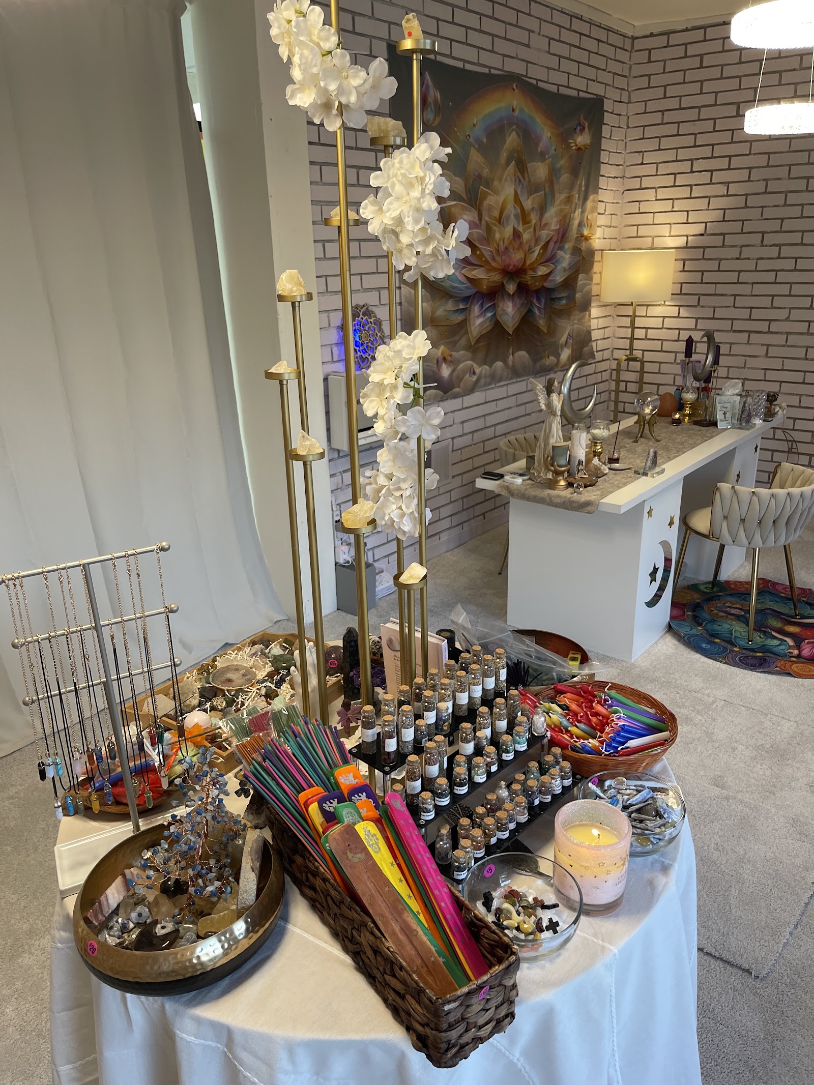 Inside the Lansing Psychic studio — crystals, candles, incense, jewelry and the reading table