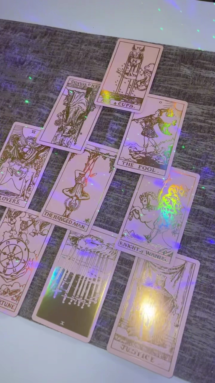 Angel's holographic tarot deck spread on the reading table